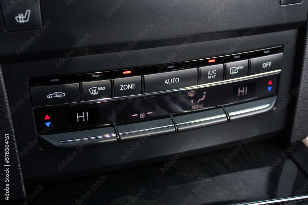 Modern car climate control panel for driver and passenger with shallow depth of field. Zone climate control. Car interior detail. Modern car climate control panel for driver and passenger with shallow depth of field. Zone climate control. Car interior detail.