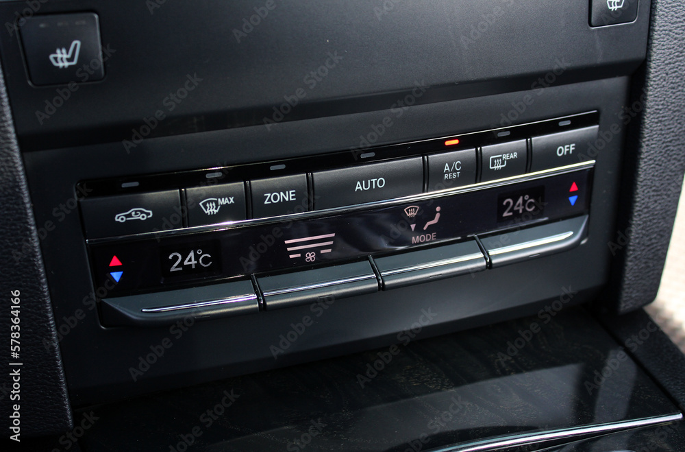 Modern car climate control panel for driver and passenger with shallow depth of field. Zone climate control. Car interior detail. Modern car climate control panel for driver and passenger with shallow depth of field. Zone climate control. Car interior detail.