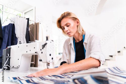 Female fashion designer at work in a clothing textile start-up business