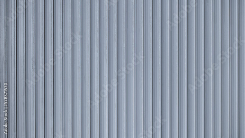 Corrugated sheet metal, badly painted with gray paint for background. Metal corrugated roofing sheet. Abstract background for sites and layouts. Iron fence