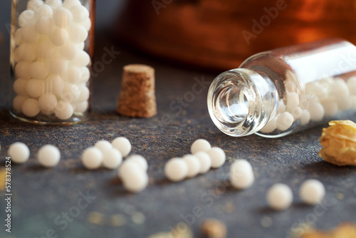 A bottle with homeopathic globules, close up