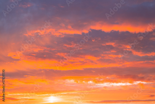 Dark orange sky with clouds at sunset. Natural natural bright background © Natalia