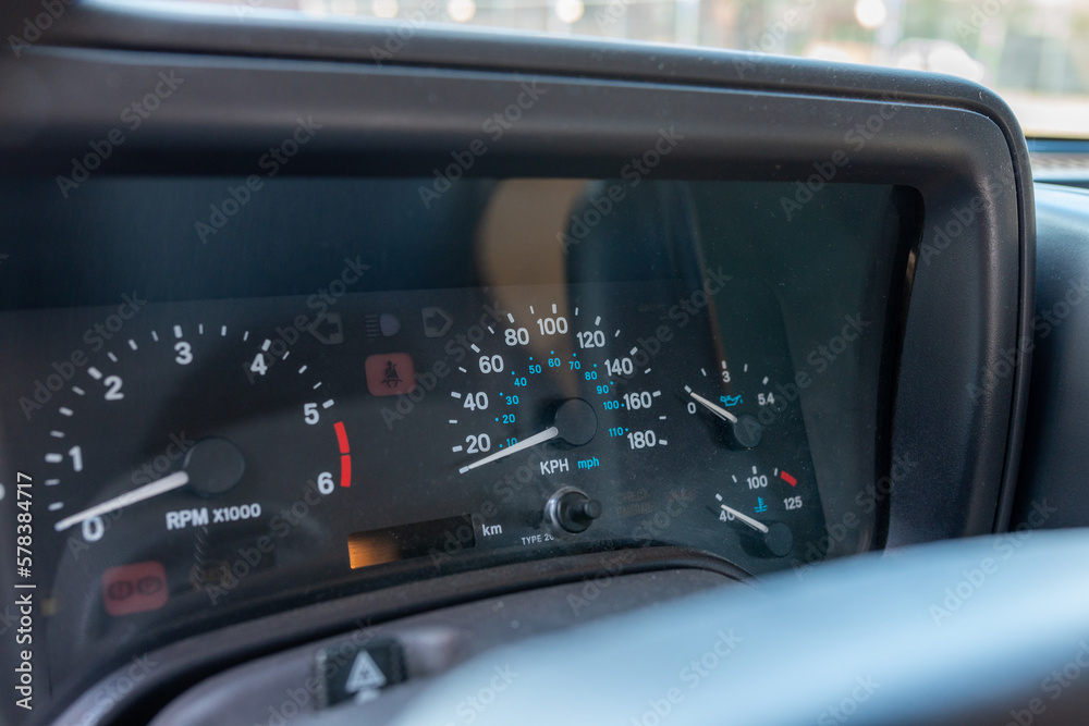 Car dashboard detail view with speedometer Car dashboard detail view with speedometer