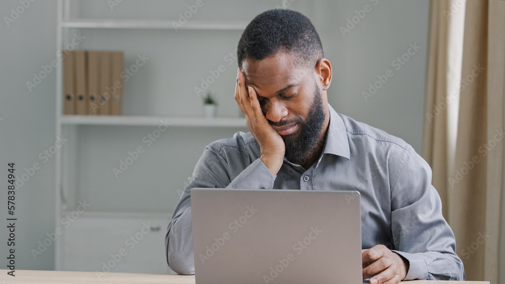 Lazy bored sleeping office worker sleep napping at work African American businessman manager executive falling asleep at workplace sitting at desk tired ethnic male employee with laptop overworked Lazy bored sleeping office worker sleep napping at work African American businessman manager executive falling asleep at workplace sitting at desk tired ethnic male employee with laptop overworked