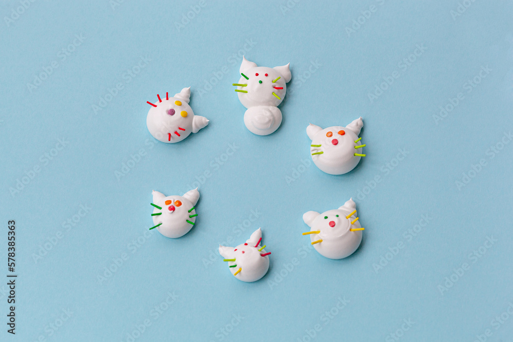 handmade delicious meringue in the form of funny cats of different colors handmade delicious meringue in the form of funny cats of different colors