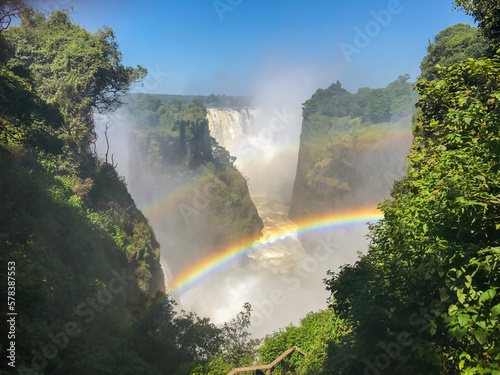 The iconic Victoria Falls,  Mosi-Oa-Tunya waterfall, view from the Zimbabwe side, with a double rainbow. photo