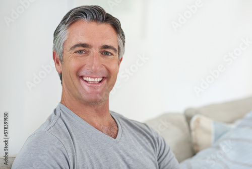 Who doesnt love the weekend. Portrait of a handsome mature man relaxing at home.