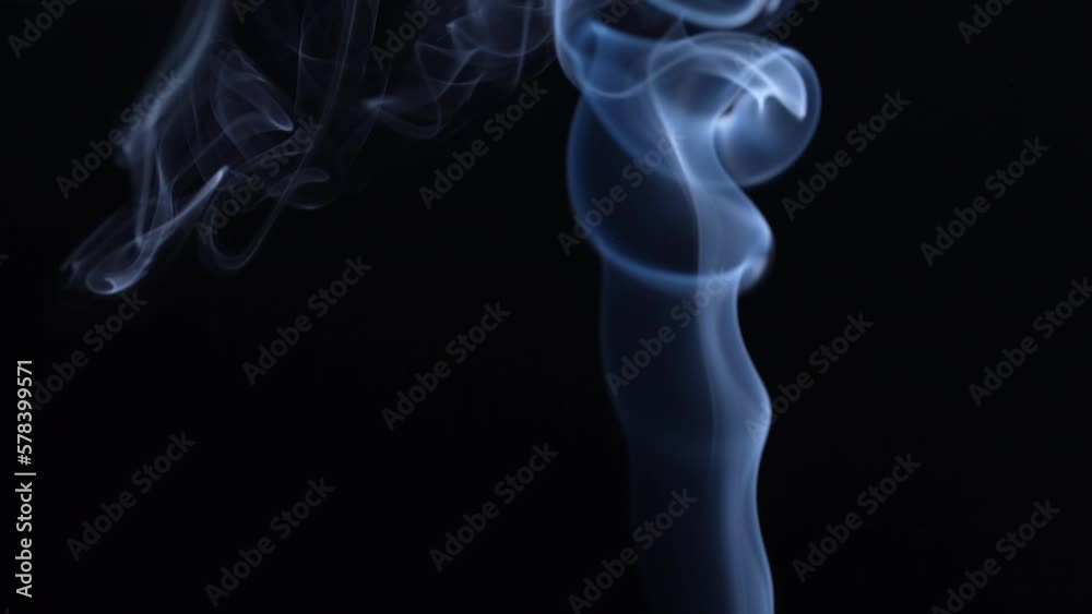 Puffs of smoke on a black background. Close-up Puffs of smoke on a black background. Close-up