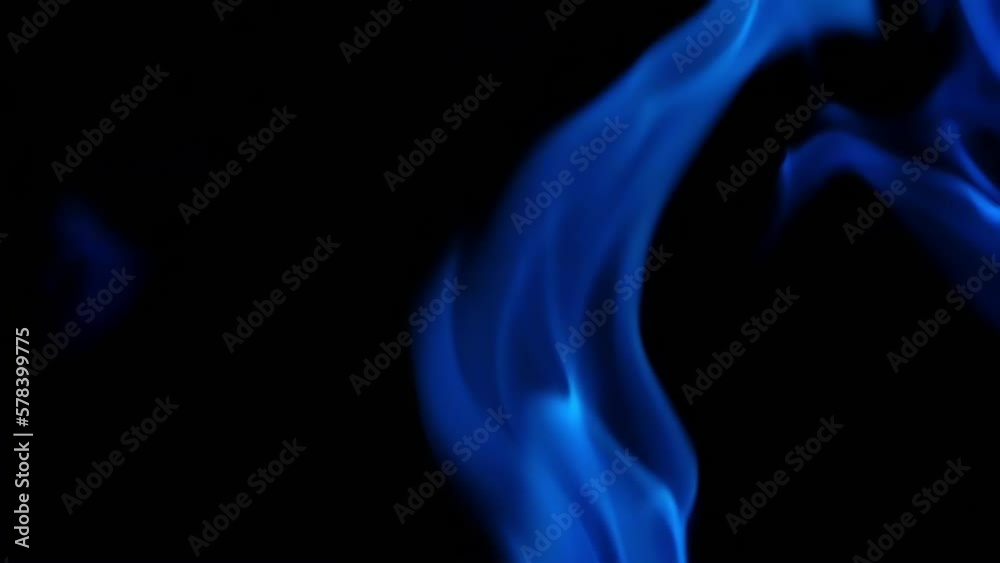 Blue flame close-up on a black background. Burning footage 4K. Fire pattern. Blue flame close-up on a black background. Burning footage 4K. Fire pattern.