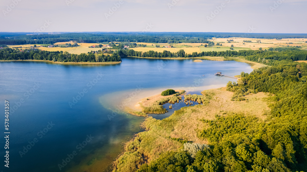 This stunning drone panorama captures a lake in Poland's Lubuskie Voivodeship on a bright and sunny spring day This stunning drone panorama captures a lake in Poland's Lubuskie Voivodeship on a bright and sunny spring day