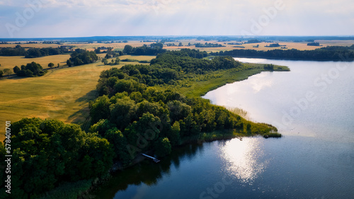 Immerse Yourself in the Majestic Scenery of Poland s Yellow Rapeseed Field at Sunset  with a Blue Sky as the Perfect Backdrop