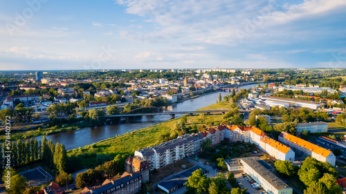 In Gorzów Wielkopolski, a drone photo was taken on a sunny day featuring the River Warta, the Cathedral, and the city center © Sebastian