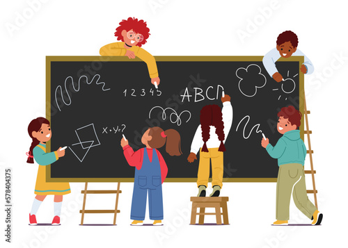 Children Stand In Front Of Blackboard, Writing With Chalk. Concept Of School Education, Innocence Of Childhood