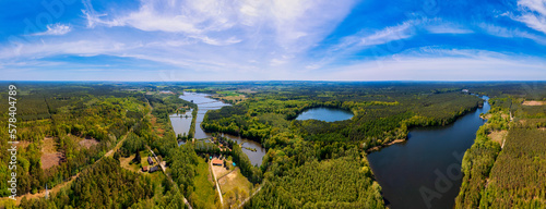 This stunning drone panorama captures a lake in Poland's Lubuskie Voivodeship on a bright and sunny spring day