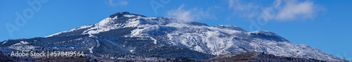 snow-capped mountains, blue skies, trees