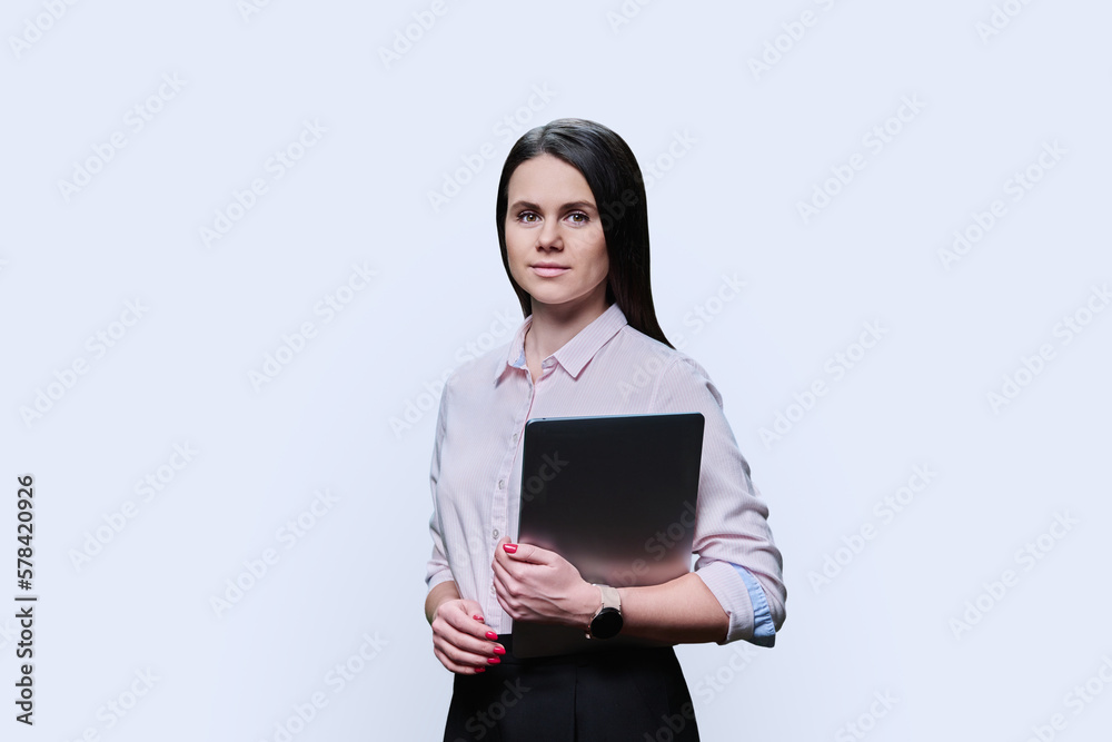 Portrait of young woman with laptop on white background Portrait of young woman with laptop on white background
