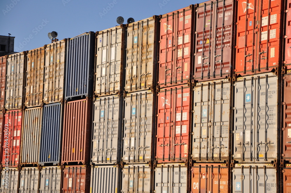 Fototapeta premium Rijeka,Croatia, February 2023.Stack of containers in a harbor. Plenty of varicolored shipping containers stacked at the Port of Rijeka.