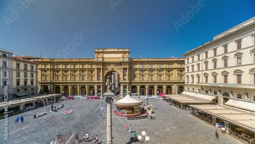 Republic Square timelapse with Colonna dell Abbondanza and the arch in honor of the first king of united Italy, Victor Emmanuel II. Top aerial view. Blue sky at summer day. Florence, Italy photo