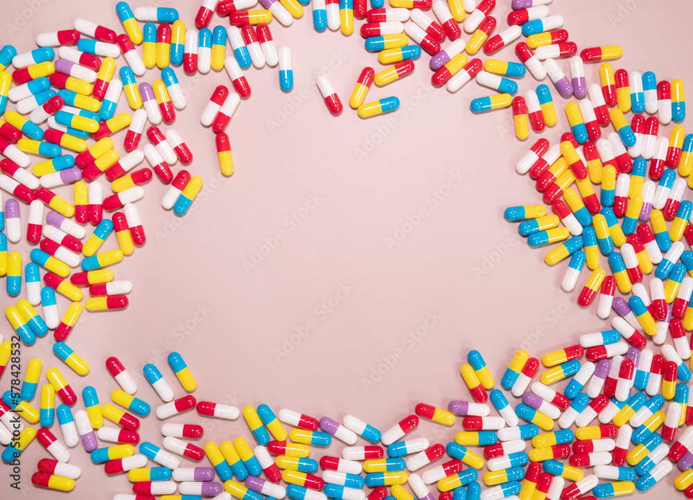 Medicine pills, tablets, capsules frame over beige background. Copy space. Pharmacy industry concept.