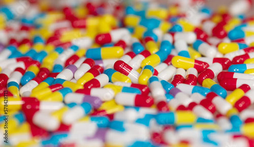 Different pills on beige background, flat lay. 