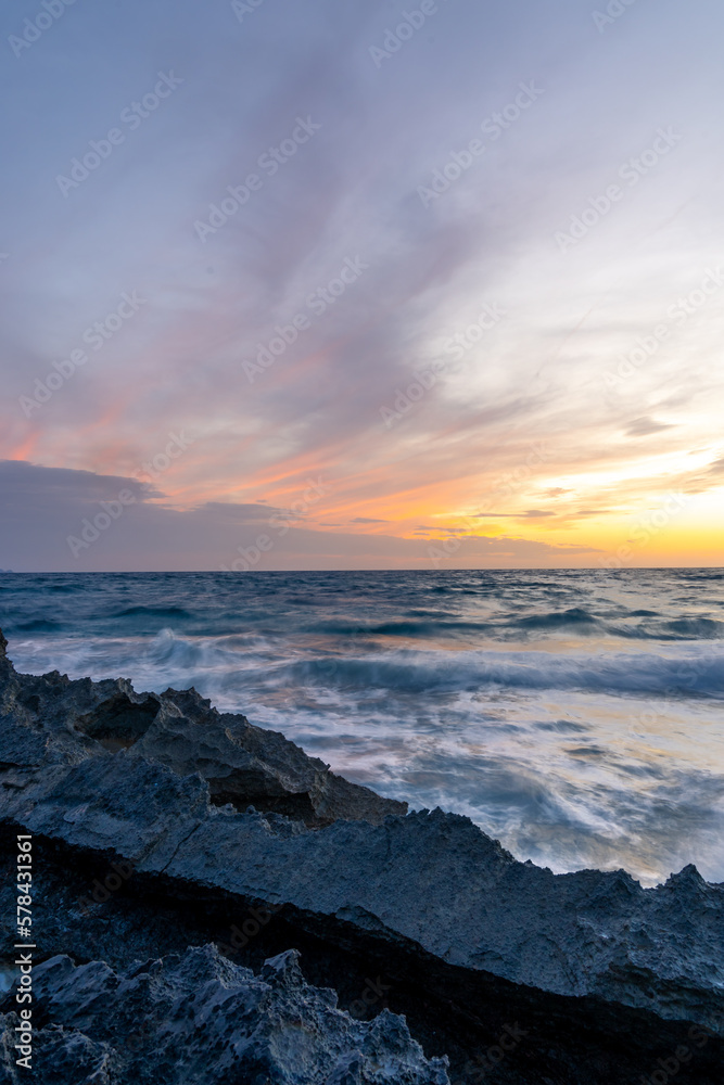 Fototapeta premium Island scenery, Cap de Ses Salines cloudy sunset on Majorca, Spain Mediterranean Sea