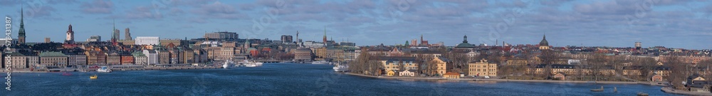 Panorama over the bay Strömmen, the old town, islands with museums, government houses, churches and boats, a sunny spring day in Stockholm
