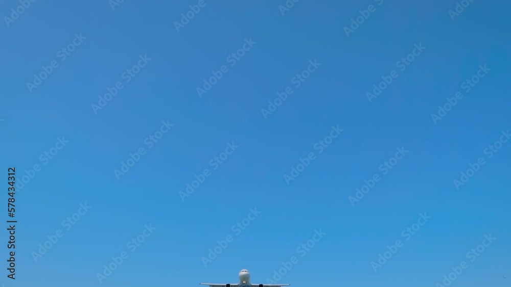 Slow motion: arriving passenger airplane, airliner is flying in the blue sky - wide angle shot. Incoming, arrival, approaching, journey, flight and tourism concept Slow motion: arriving passenger airplane, airliner is flying in the blue sky - wide angle shot. Incoming, arrival, approaching, journey, flight and tourism concept