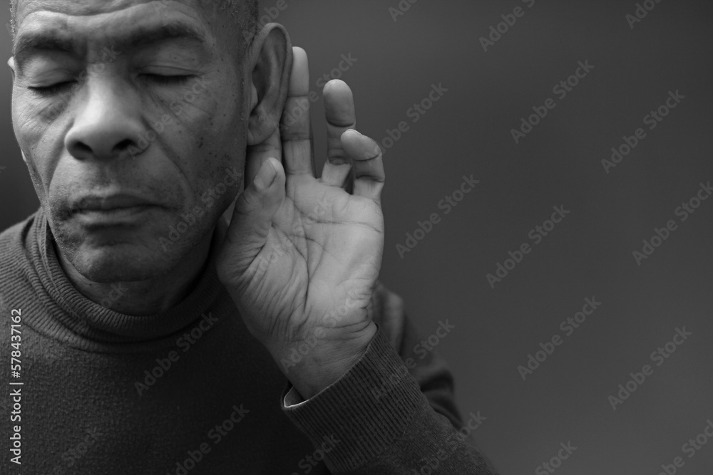 suffering from deafness and hearing loss on grey background with people stock photo	