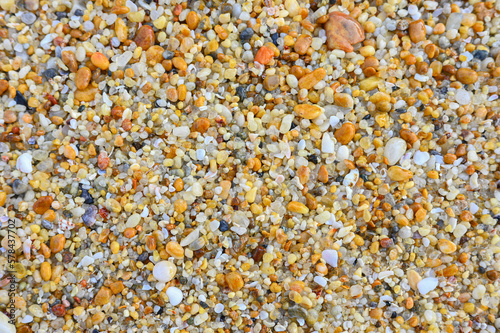Plenty of colorful pebbles on the seashore.