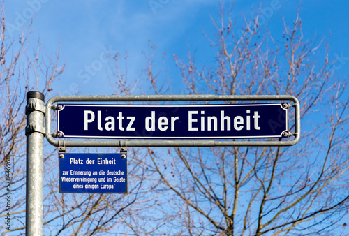 old enamel street name sign Platz der Einheit - engl:  German unity - in Frankfurt, Germany photo