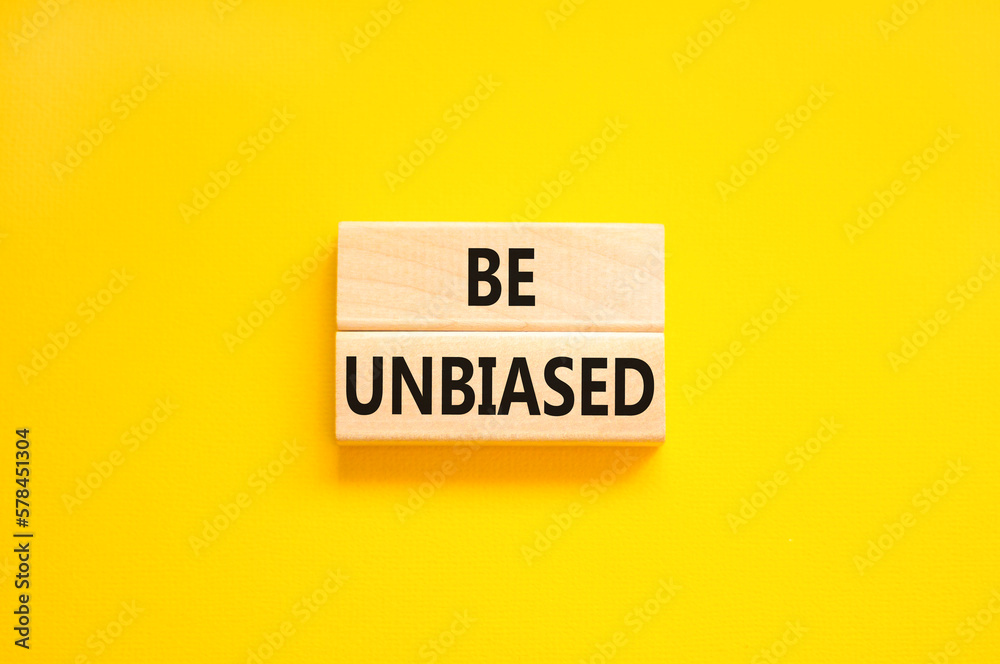 Be unbiased symbol. Concept words Be unbiased on wooden block. Beautiful yellow table yellow background. Business psychology be unbiased concept. Copy space. Be unbiased symbol. Concept words Be unbiased on wooden block. Beautiful yellow table yellow background. Business psychology be unbiased concept. Copy space.