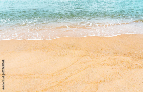 Summer Beach top view Blue ocean with soft wave form on Sand Texture Horizontal Seaside view of Brown Beach sand dune in Sunny day Spring Background for Travel Vocation Summer Holiday advertisement