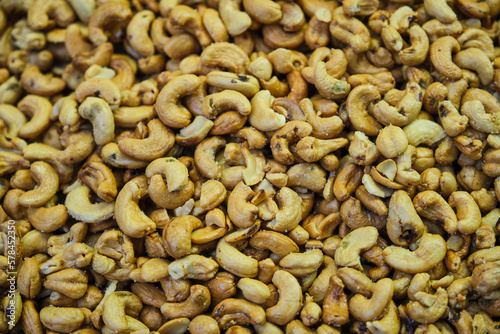 Salted cashew nuts sold in bulk at a traditional market stall