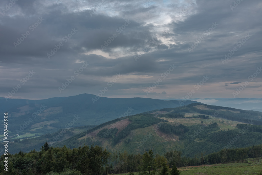 View from lookout tower Velky Javornik to Beskid Mountains in summer clouds evening