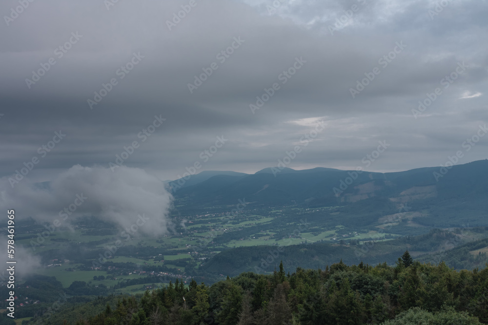 View from lookout tower Velky Javornik to Beskid Mountains in summer cloudy evening