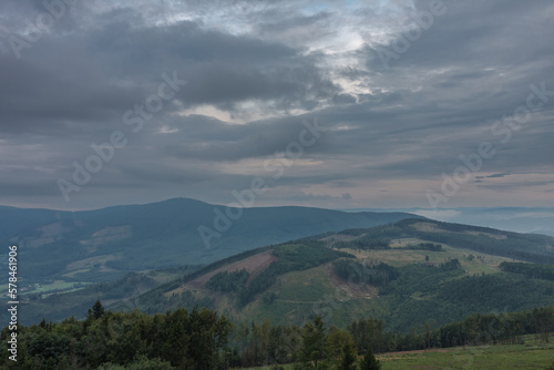 View from lookout tower Velky Javornik to Beskid Mountains in summer clouds evening