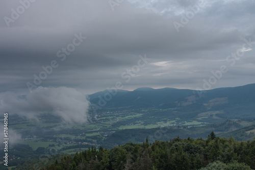 View from lookout tower Velky Javornik to Beskid Mountains in summer cloudy evening © patrikslezak