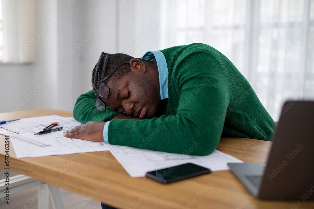 African Businessman Sleeping Near Laptop Tired Of Work In Office African Businessman Sleeping Near Laptop Tired Of Work In Office