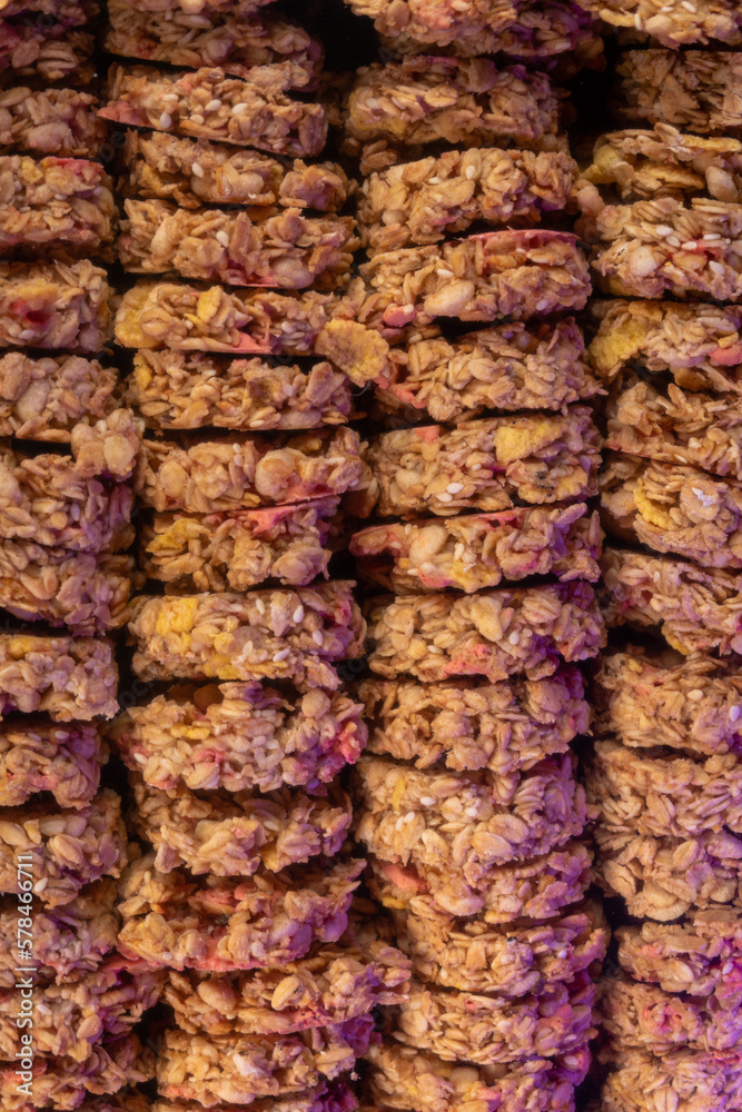 Oat and corn flakes cookies. Healthy natural food. Rows are stacked on top of each other. Vertical photo.