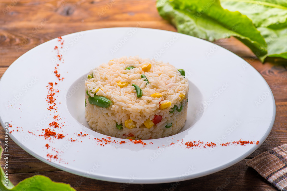 boiled rice with vegetables in a white plate boiled rice with vegetables in a white plate