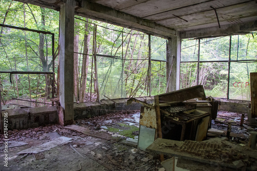 Shop is Chernobil. radioactive vehicles graveyard in Chernobyl, summer season in exclusion Zone, Ukraine - Julia 4 2021