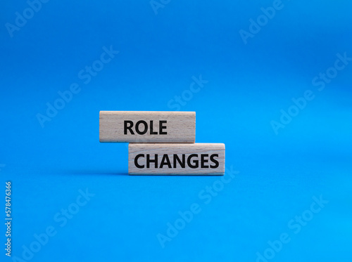 Role changes symbol. Concept words Role changes on wooden blocks. Beautiful blue background. Business and Role changes concept. Copy space.