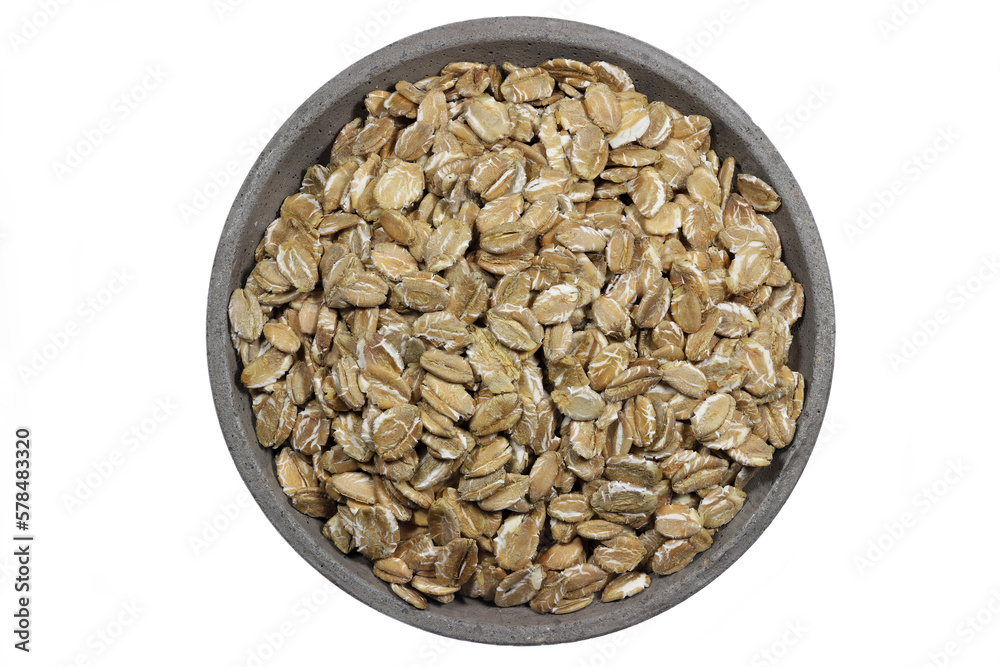rye flakes in a concrete bowl isolated on white background