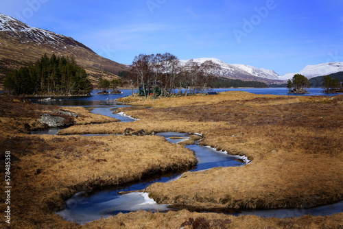 A frozen stream leads to Loch Ossian, at Corrour, Scottish Highlands