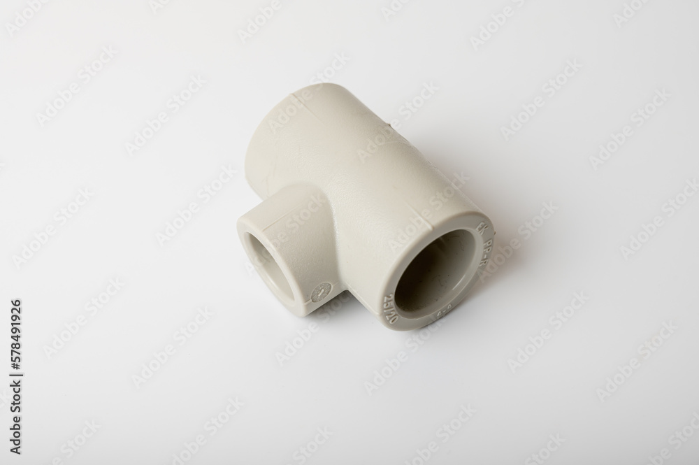 light PVC pipe tee connection for water isolated on light background close-up, connection for plumbing light PVC pipe tee connection for water isolated on light background close-up, connection for plumbing