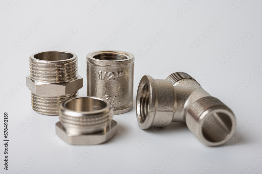 brass metal tee water adapters isolated on light background close up plumbing connections and details brass metal tee water adapters isolated on light background close up plumbing connections and details