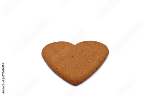 Heart shaped gingerbread cookie. Isolated on a white background.