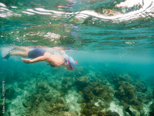 woman snorkeling in clear tropical sea © Melinda Nagy