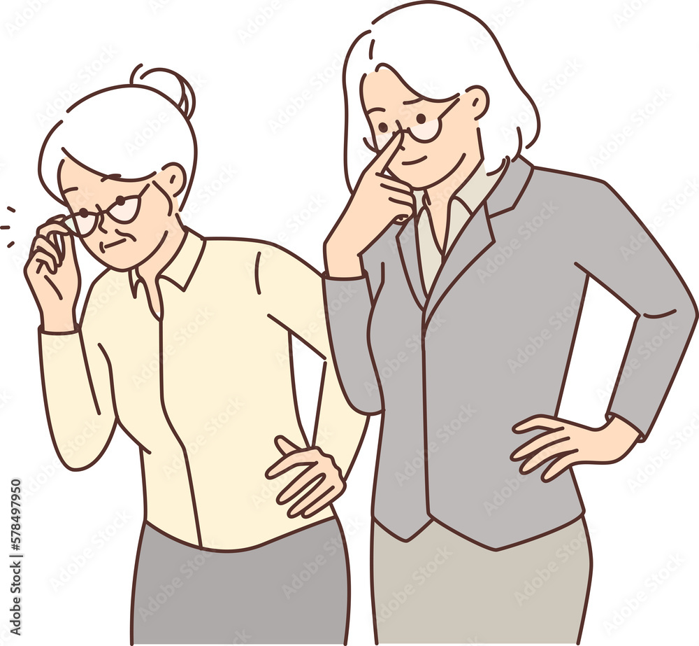Two elderly women in business clothes carefully look to side watching work of young employees