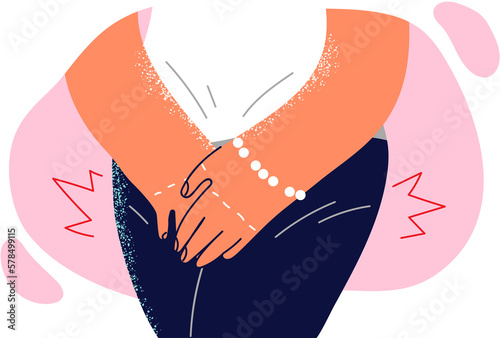 Cuadro en lienzo Woman presses hands to groin, having experienced sharp desire to visit toilet du